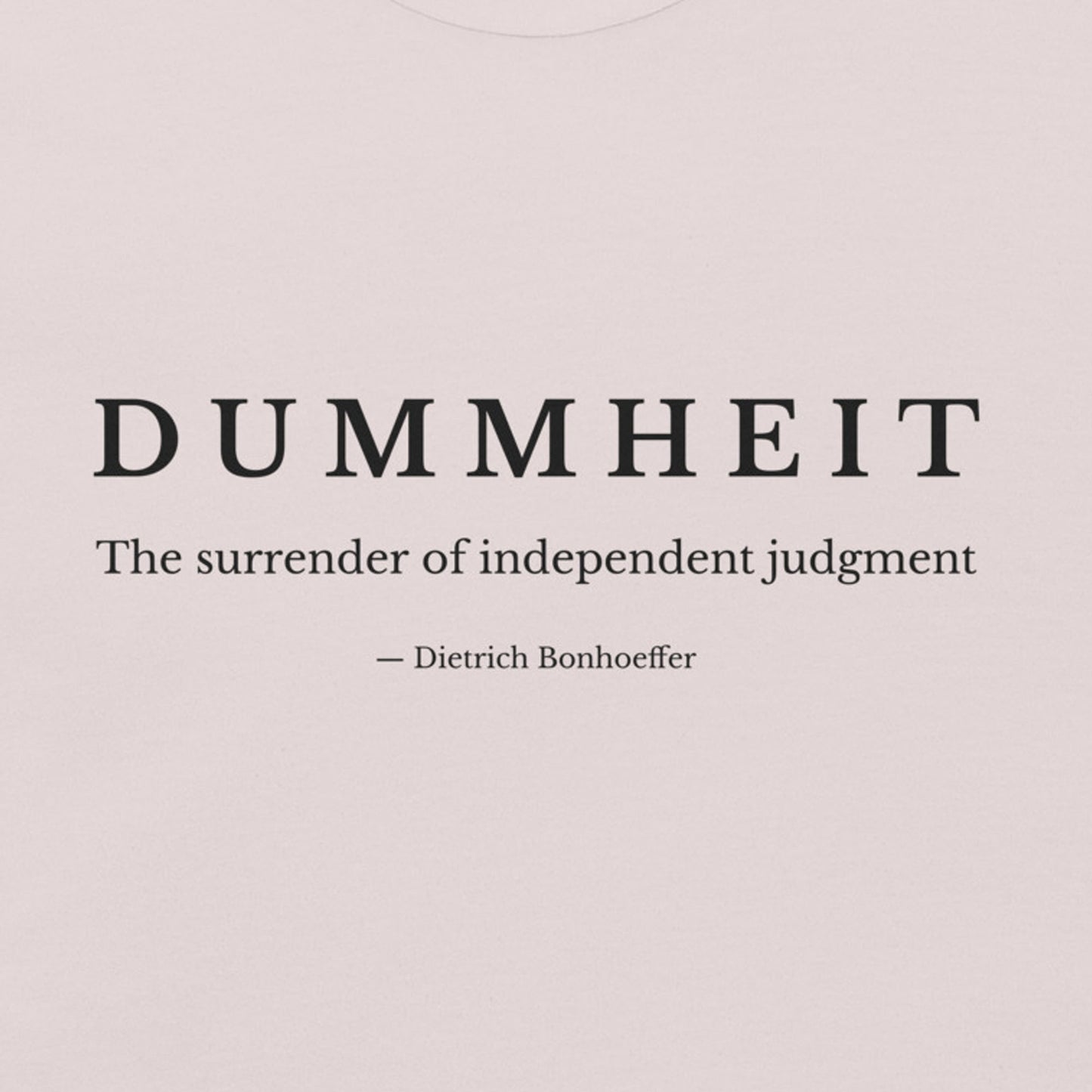 ice grey shirt with minimalist typography reading “Dummheit – The surrender of independent judgment,” inspired by Dietrich Bonhoeffer’s philosophy on independent judgment. zoom design