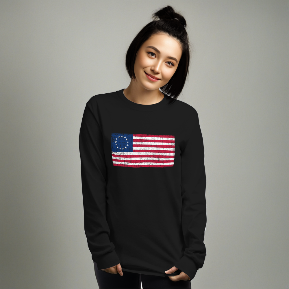 Person wearing black long sleeve t-shirt with a distressed image of the Betsy Ross Flag.
