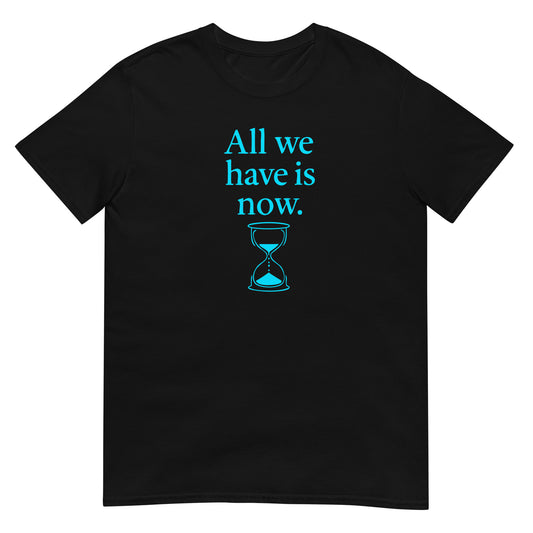 Black unisex t-shirt featuring the phrase “All We Have Is Now” in sky blue text, with an hourglass graphic in matching color below the words. Inspired by Marcus Aurelius, the design symbolizes the fleeting nature of time and encourages presence in the moment.