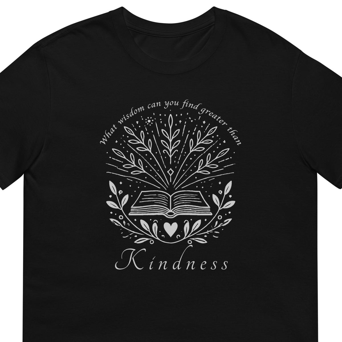 A black short-sleeve crewneck t-shirt featuring a white graphic print on the front. The design shows an open book surrounded by leaves and stars, with the text 'What wisdom can you find greater than' arched above and 'Kindness' written below.