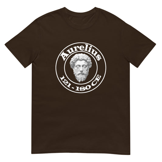 Dark Chocolate unisex t-shirt featuring a circular white graphic with a marble-style bust of Marcus Aurelius at the center. The name "Aurelius" is written above the bust, and the dates "121–180 CE" are written below, all enclosed within the circle.