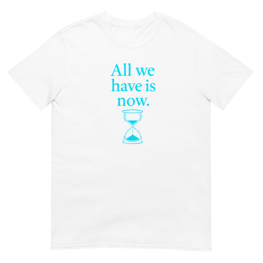 White unisex t-shirt featuring the phrase “All We Have Is Now” in sky blue text, with an hourglass graphic in matching color below the words. Inspired by Marcus Aurelius, the design symbolizes the fleeting nature of time and encourages presence in the moment.