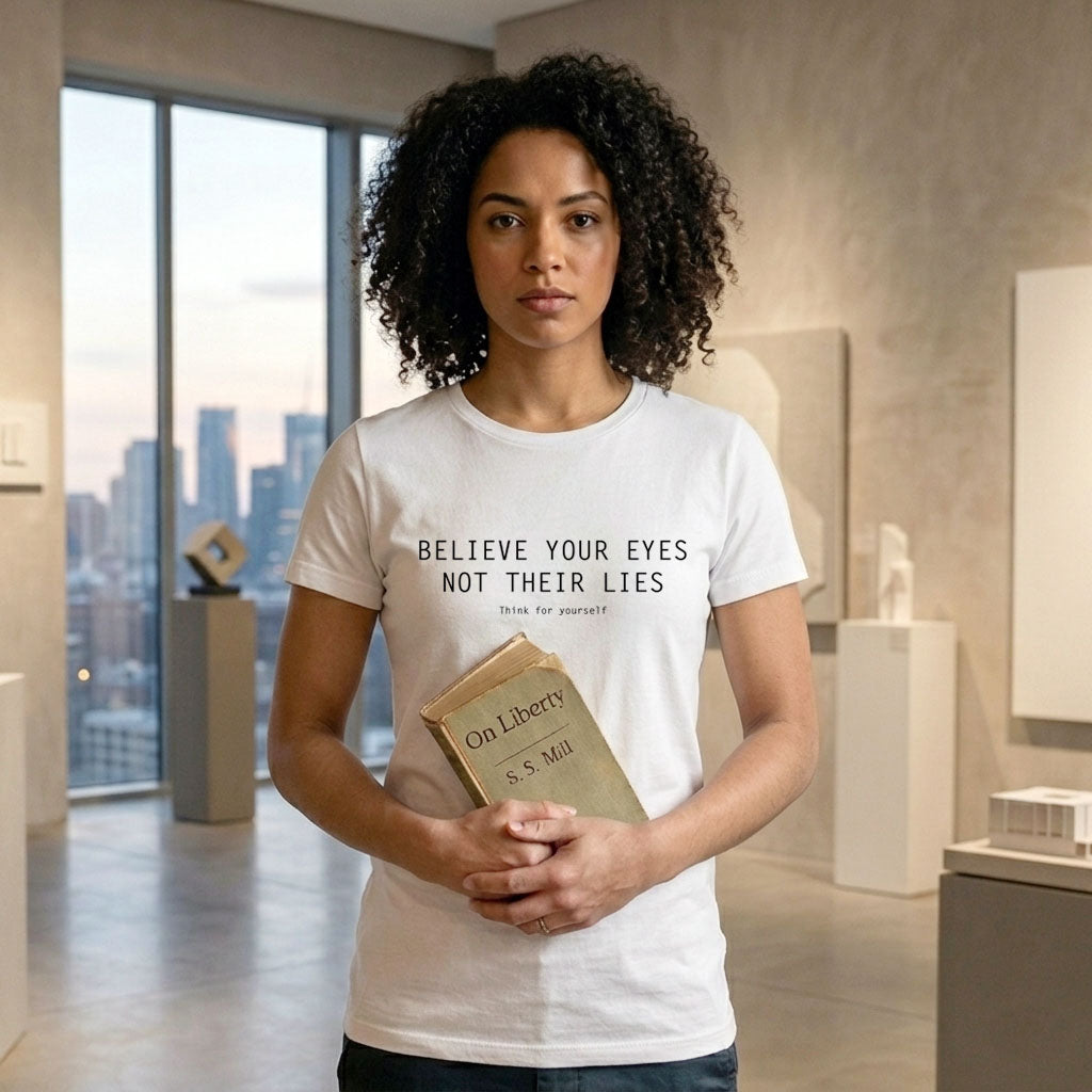 Person holding a book wearing white tshirt with text believe your eyes not their lies