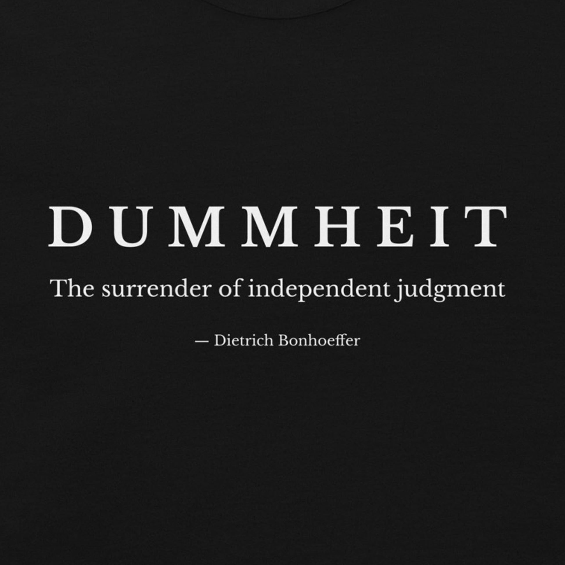black shirt with minimalist typography reading “Dummheit – The surrender of independent judgment,” inspired by Dietrich Bonhoeffer’s philosophy on independent judgment. zoom design