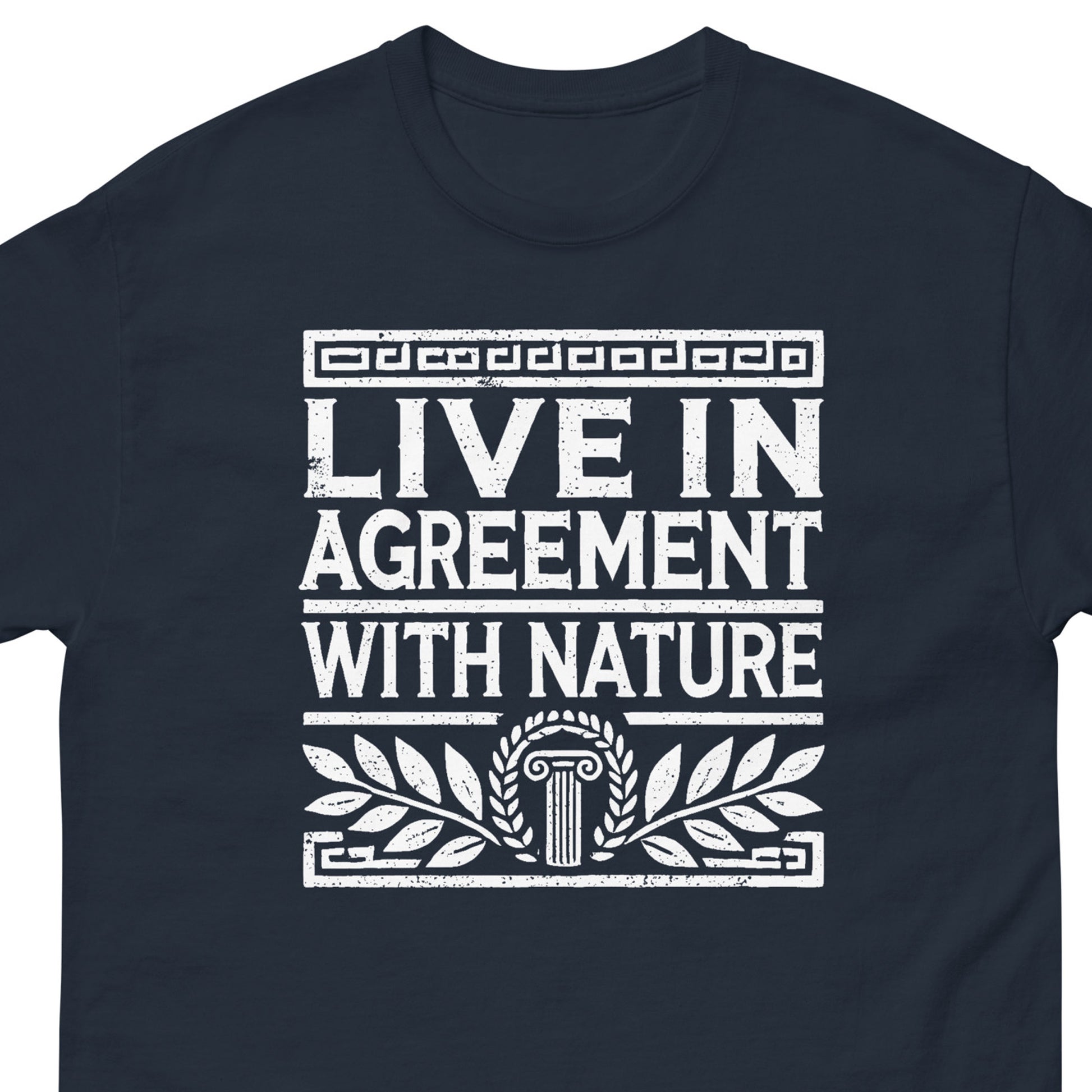 A navy blue crewneck t-shirt featuring a distressed white graphic print that reads 'LIVE IN AGREEMENT WITH NATURE' with classical architectural and laurel leaf motifs.