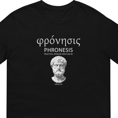 Black t-shirt Aristotle design with Greek word φρόνησις (Phronesis), text “Practical Wisdom Since 384 BC,” and Aristotle illustration.