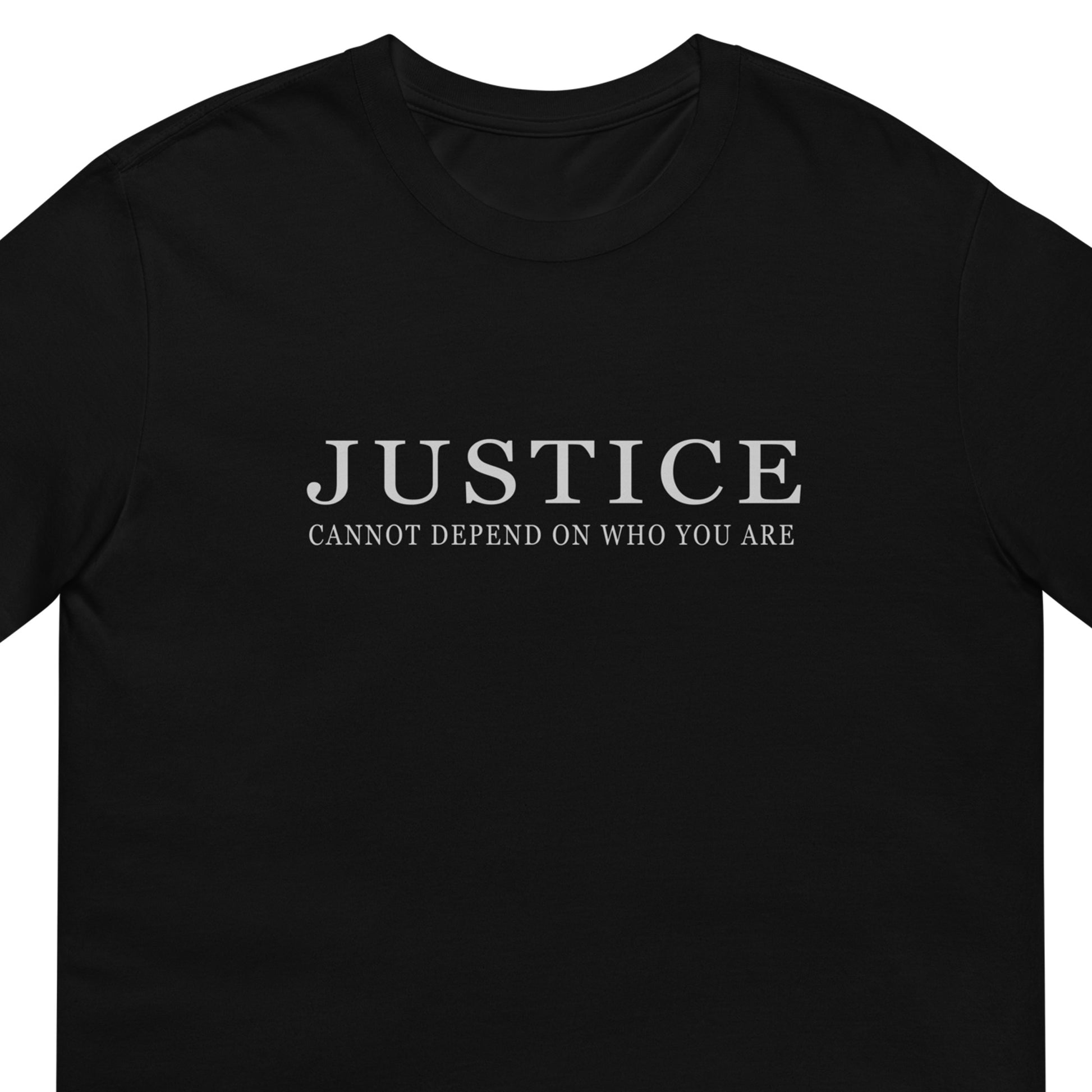 A black short-sleeve crewneck t-shirt with the text 'JUSTICE CANNOT DEPEND ON WHO YOU ARE' printed in white serif font across the chest.