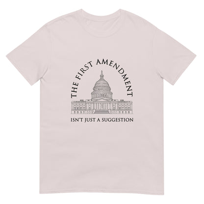 Ice grey t-shirt with the text "The First Amendment" in an arch over a line drawing of the US Capitol. A line of text across the bottom of the design "Isn't Just A Suggestion"