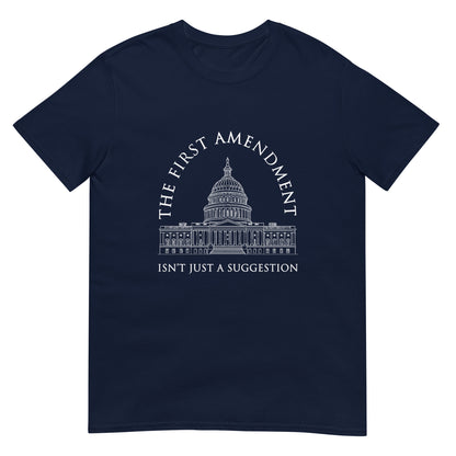 Navy t-shirt with the text "The First Amendment" in an arch over a line drawing of the US Capitol. A line of text across the bottom of the design "Isn't Just A Suggestion"