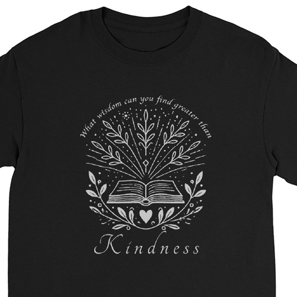 A black long sleeve crewneck t-shirt featuring a silver graphic print of an open book surrounded by leaves and stars, with the text 'What wisdom can you find greater than Kindness' arched above and 'Kindness' written below.