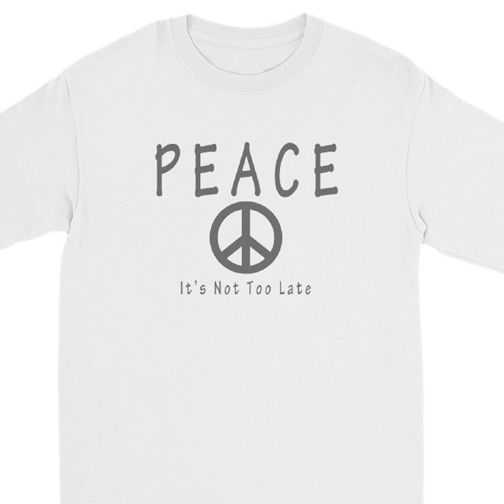 A white long-sleeve crewneck t-shirt featuring a dark gray graphic print on the front with the word 'PEACE', a peace symbol, and the text 'It's Not Too Late'.
